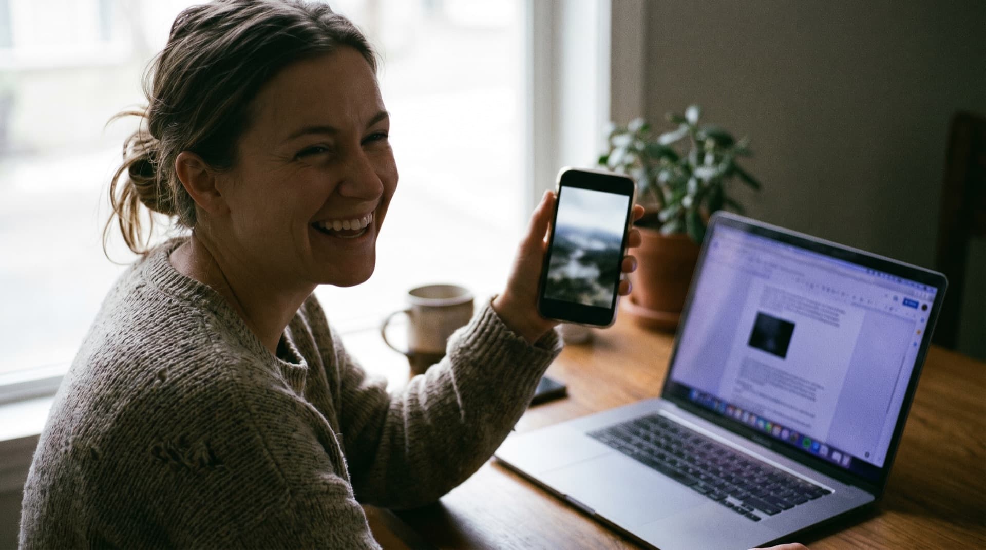 A person turning a phone photo into a PDF on their laptop, converted on-device